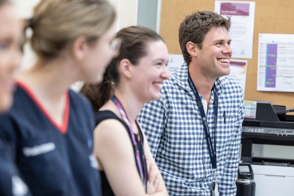 Home Dr Jackson smiling with Medical Staff