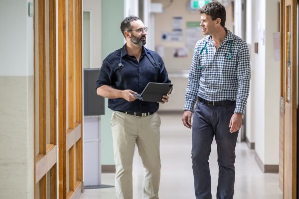 Home Dr Michael MacPherson and Dr Simon Jackson Conversing in hallway
